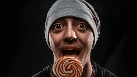 Guy with Chupa Chups Stock Footage 87616877