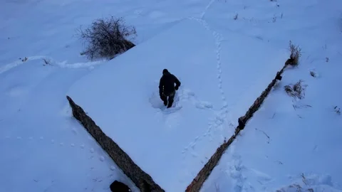 A guy cleans the chimney from snow in winter Stock-Footage 233659695