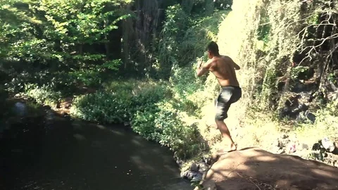 Guy Cliff Jumping in Hawaii, HD Stock Footage 97093510