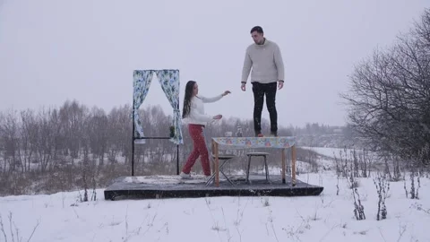 Guy Climbed on the Table in Winter Stock Footage 144637197