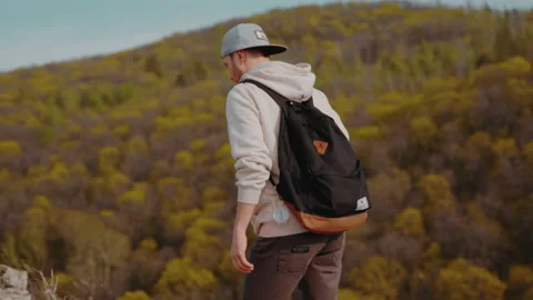 The guy climbs up the mountain . Stock Footage 171380920