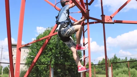 The guy climbs the telephone tower Stock Footage 130737097