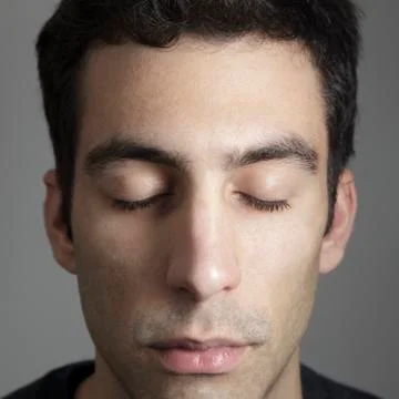 Guy with closed eyes Stock Photos