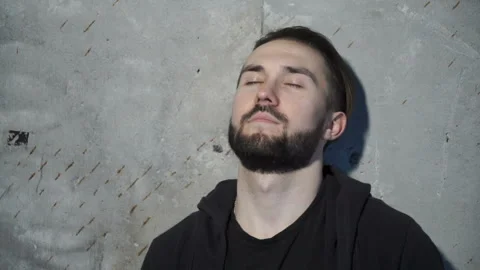 Guy is closing his eyes Video stock 86261224