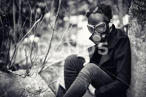 The guy in the coat and gas mask. Post-apocalyptic portrait of A Stock Photos
