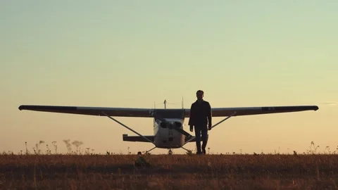 Guy comes back from an airplane trip. Stock Footage 276733524