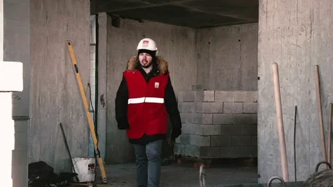 Guy comes to the builder and talks to him Stock Footage 82145587