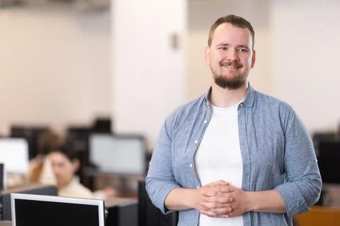 Guy in computer design and information technology classroom Stock Photos
