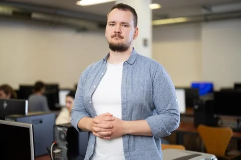 Guy in computer design and information technology classroom Stock Photos