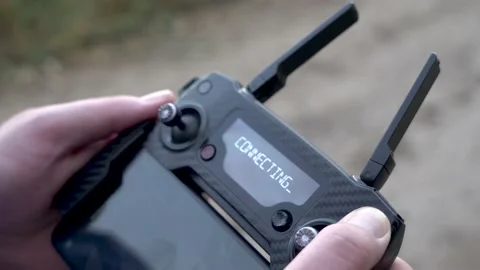 The guy controls the drones. remote control of the drone in hands. Stock Footage 157320051