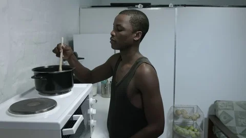Guy cooking a meal Stock Footage 72585453