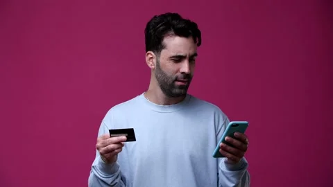 The guy is copying the data from the bank card to the phone Stock Footage 162842338