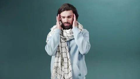 The guy coughs, squeezes his eyes tightly, showing poor health Stock Footage 170674461