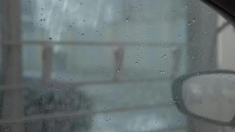 The guy covers the car with wax, the view from the salon Stock Footage 102111911