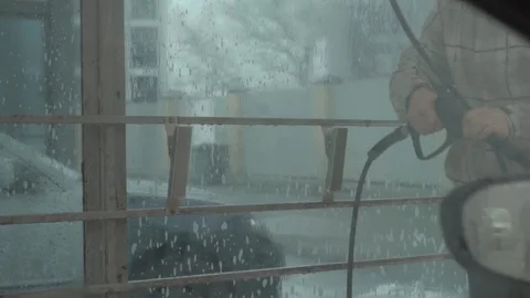The guy covers the car with wax, the view from the salon Stock Footage 102111913