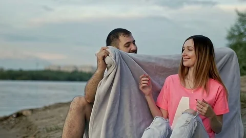 Guy to covers the girl with a blanket Video stock 79604587
