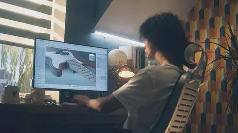 Guy creating 3D prototype of guitar Foto stock