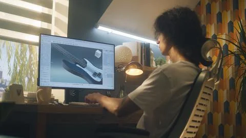 Guy creating 3D prototype of guitar 스톡 사진