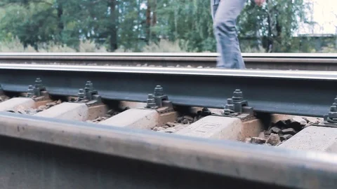 The guy crosses the railroad Stock Footage 113859394