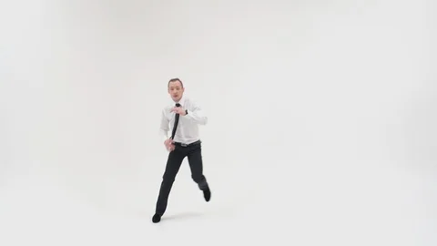 The guy dances the upper breakdance, jumps up and spreads his legs and puts his Stock Footage 128200912