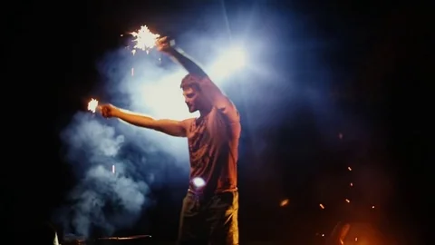 The guy dances in the woods with the lights on the background of smoke Stock Footage 79791045