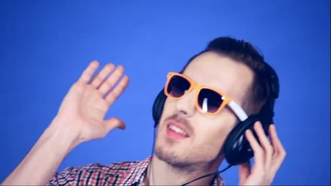 Guy dancing on a blue background Stock-Footage 74954032