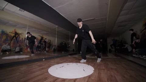 Guy dancing break dance in the hall with mirrors. Youth subculture. Slow motion Stock Footage 131879168