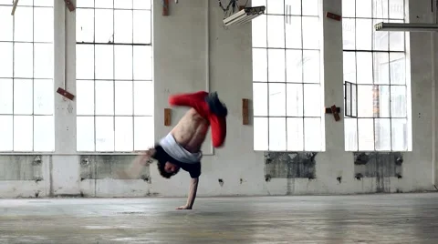 Guy dancing breakdance in the old hall Stock Footage 41750457