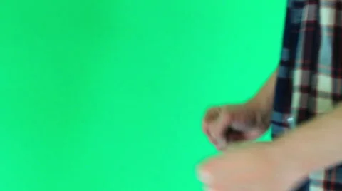 The guy is dancing on a green background Stock Footage 60745415