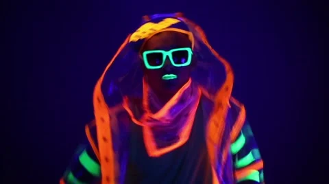 Guy dancing in neon costume Stock Footage