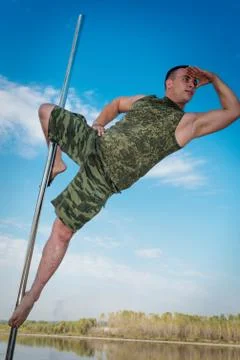 Guy dancing on a pole Foto stock