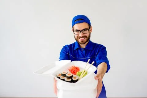 Guy delivering sushi Stock Photos