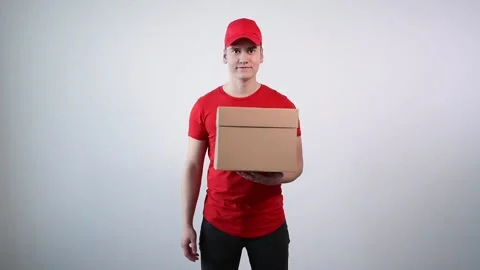 Guy from the delivery service in overalls knocks on the door. Parcel close up Stock Footage 132466922