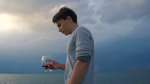 The guy is depressed drinking wine Stock Footage 81391437