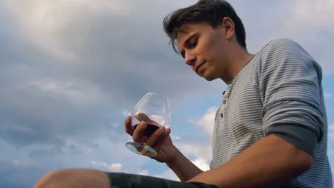 The guy is depressed drinking wine Video stock 81391461