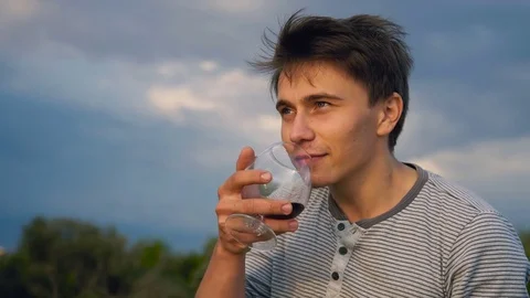 The guy is depressed drinking wine Video stock 81391463