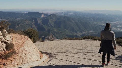Guy descends a steep slope from a mountain, Spain Stock Footage 101270184