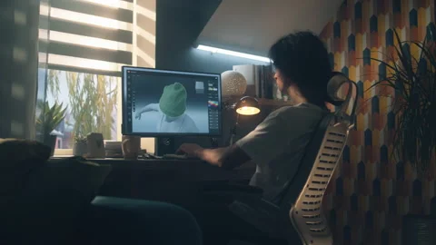 Guy designing clothes in 3D modeling software Stock Footage 211795062