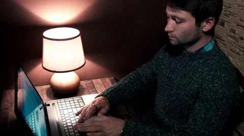 The guy at the desk working on a computer Video stock 56251149