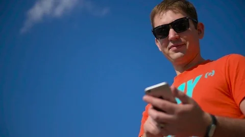 The guy dials a phone number and calls Stock Footage 76366236