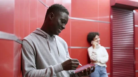 Guy with a digital tablet waiting for a train in the subway. Stock Footage 223453992