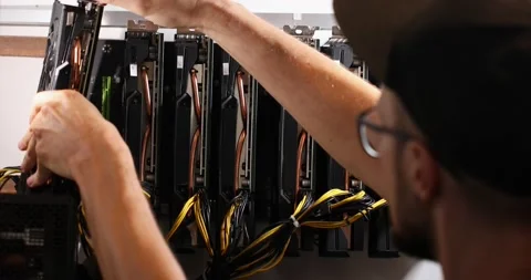 The guy disassembles his mining rig taking out the video card one by one Stock Footage 161872815