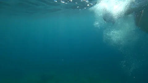 The guy dives to the bottom of the sea Stock Footage 79967016