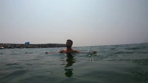 Guy dives into the sea Stock Footage 170431579