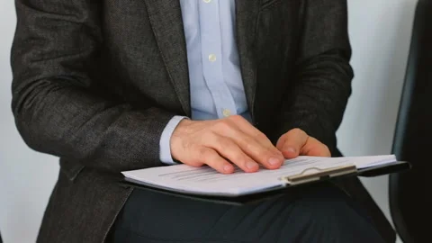 Guy documents job applicant skimming papers cv Stock Footage 106461749