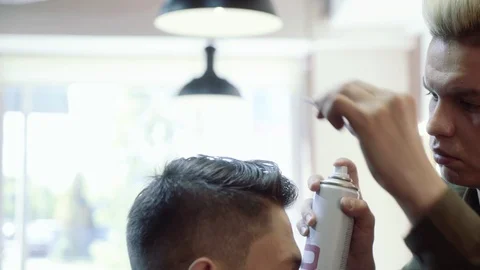 The guy does hair styling after haircuts. Barbershop. Video stock 95287294