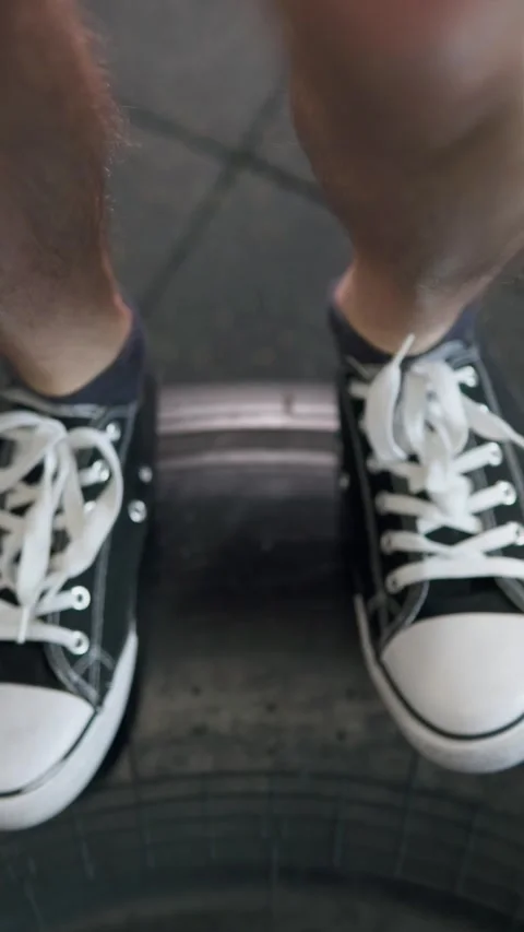 A guy does a hard workout, jumps on a big tire and becomes very strong. Stock Footage 302432929