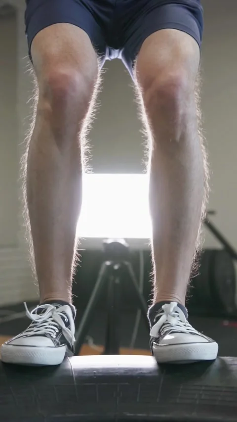 A guy does a hard workout, jumps on a big tire and becomes very strong. Stock-Footage 302433241