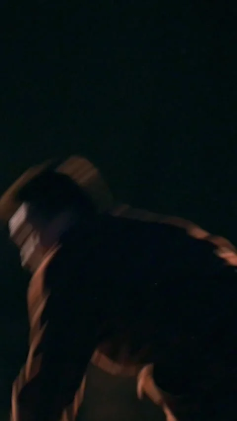 The guy does one somersault forward and two with a turn back, night city Stock Footage 346755352