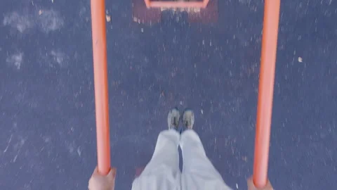 The guy does push-ups on the uneven bars. Sport. From the first person. Stock Footage 316845446